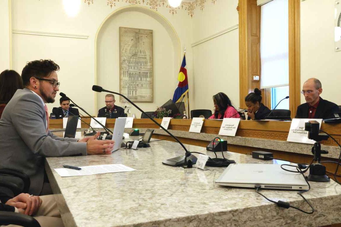 Photo of ACLU of Colorado senior policy strategist Anaya Robinson testifying in front a legislative committee